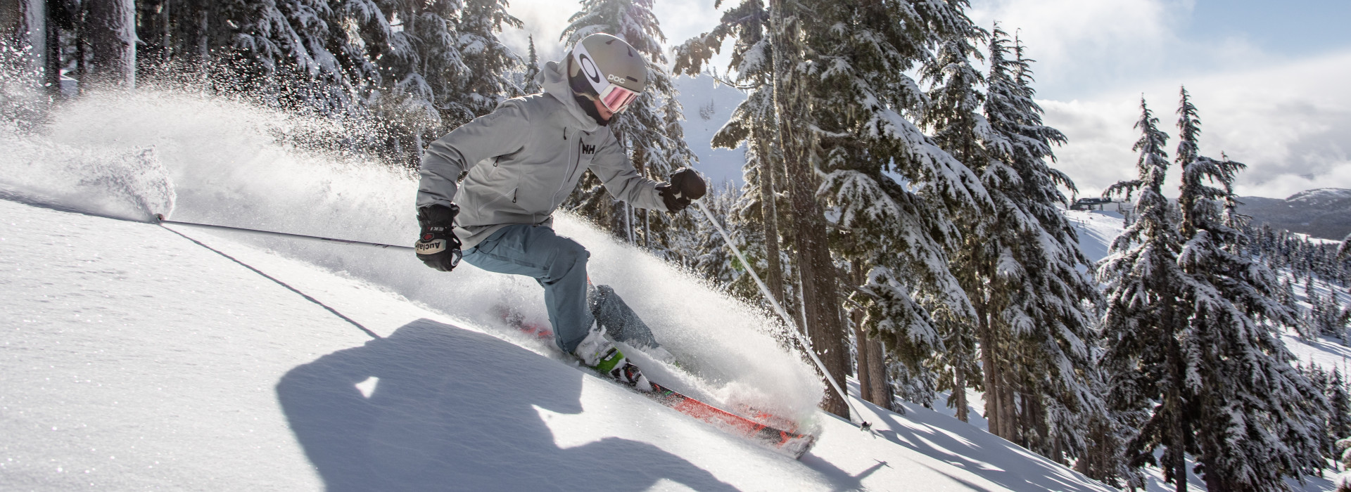 A skier on Mount Washington Alpine Resort, looking east during a nice morning run with fresh powder, frontside Boomerang Chair